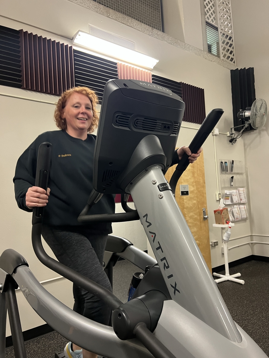 Andrea Anderson on an elliptical in Varsity Gym