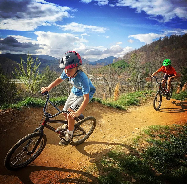 Two kids riding mountain bikes at Rocky Knob