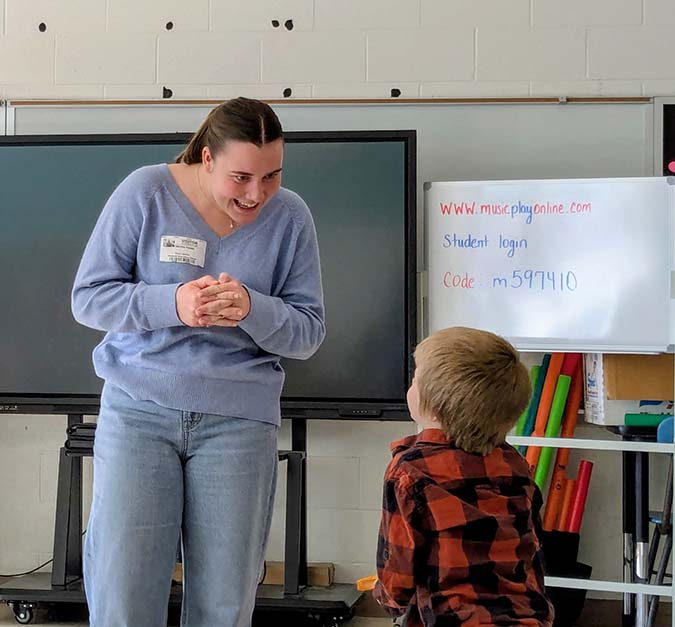App State Nutrition student interacts with child from elementary school