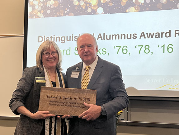 Richard Sparks accepts award from Dean Huff