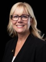 Woman with blonde hair and glasses wears a black blazer with an Appalachian A on the lapel 