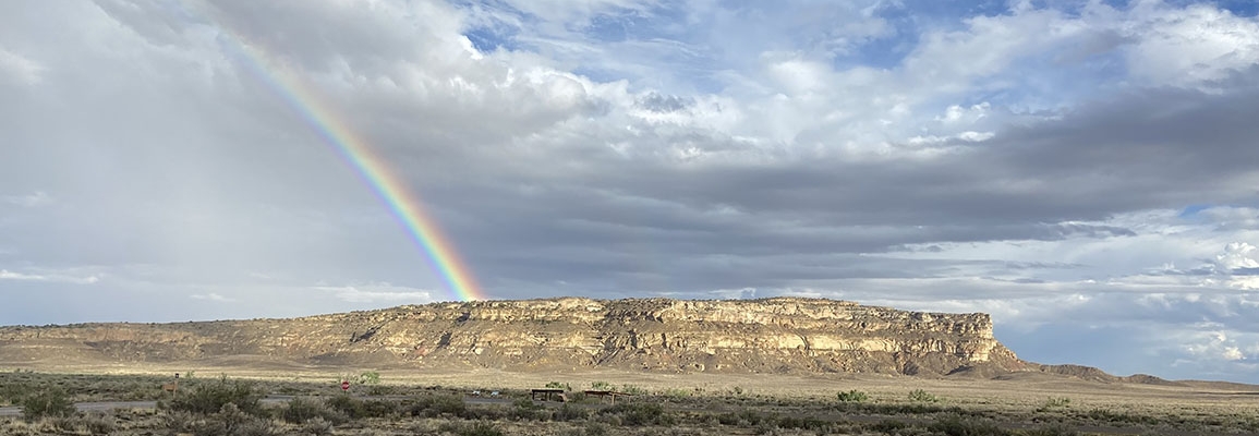 Photo showing a rainbow appearing over Chaco National Park. Photo by Dr. Joy James