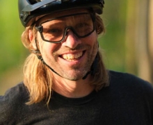 Kristian Jackson who is smiling and wearing a bike helmet