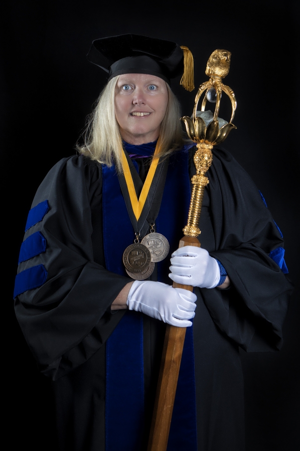 Dr. Joy James, mace bearer for the college's commencement ceremony