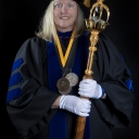 Dr. Joy James, mace bearer for the college's commencement ceremony