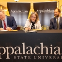 On April 29, App State and Project Kitty Hawk (PKH) signed an agreement that will help remove barriers to educational access and increase career readiness and advancement, particularly for adult learners in North Carolina. App State will launch five online degree programs supported by the project in the 2024–25 academic year. Pictured, from left to right, are PKH Chief Operating Officer David Eby, App State Interim Chancellor Heather Norris and UNC System Executive Vice President and PKH Interim President a