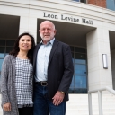 App State alumnus Dr. Ed Rankin ’79, right, and his wife, Thuy Le, of Dallas, Texas, contributed funds to launch a camp for adolescents who stutter, to be held annually on the App State campus beginning summer 2023. They are pictured in front of App State’s Leon Levine Hall of Health Sciences. Photo by Chase Reynolds
