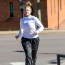 First-year student Lainie Baumgardner, of Waxhaw, runs on Appalachian State University’s campus Nov. 18 with her mask at the ready. She is a member of App State’s track and field team. It’s important to keep up physical activity throughout the winter for mental and physical health and immune system support, says App State’s Dr. Rebecca “Becki” Battista, an Exercise Is Medicine Ambassador and a board member of the Physical Activity Alliance. Photo by Marie Freeman