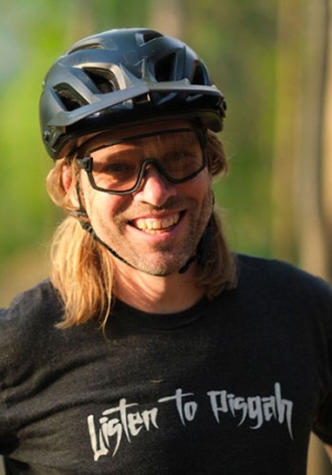 Kristian Jackson who is smiling and wearing a bike helmet