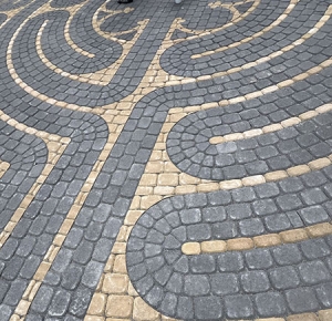 Gray and cream stones outline a pattern inside the Levine Labyrinth