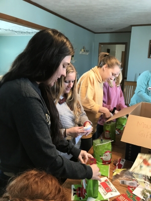 Communication Sciences and Disorders students wrapping presents